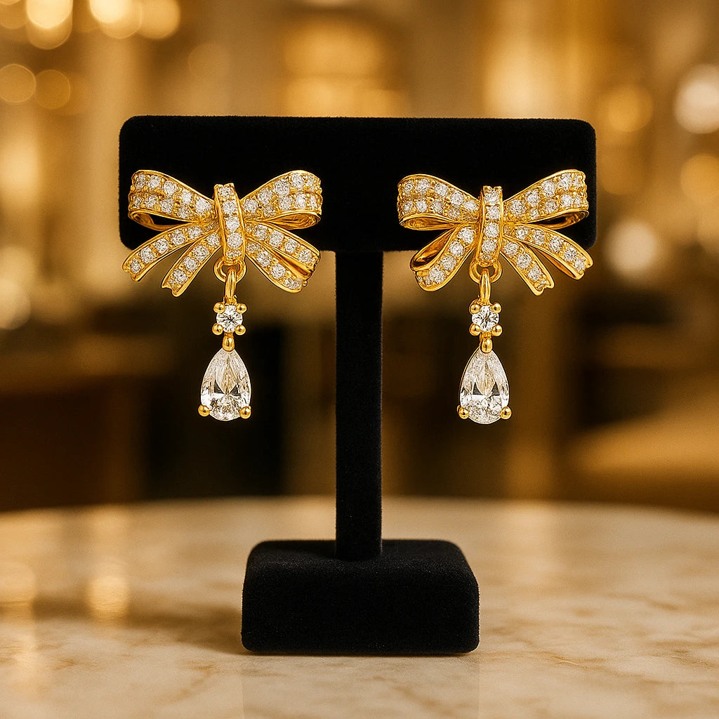 Gold-Toned Bow-Shaped Stud Earrings with Amw=erican Diamond