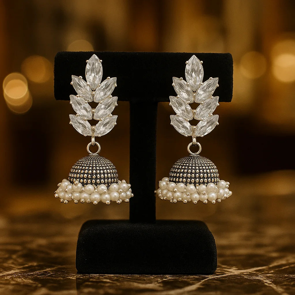 Silver Jhumka Earrings with White Stone and Pearl Embellishments