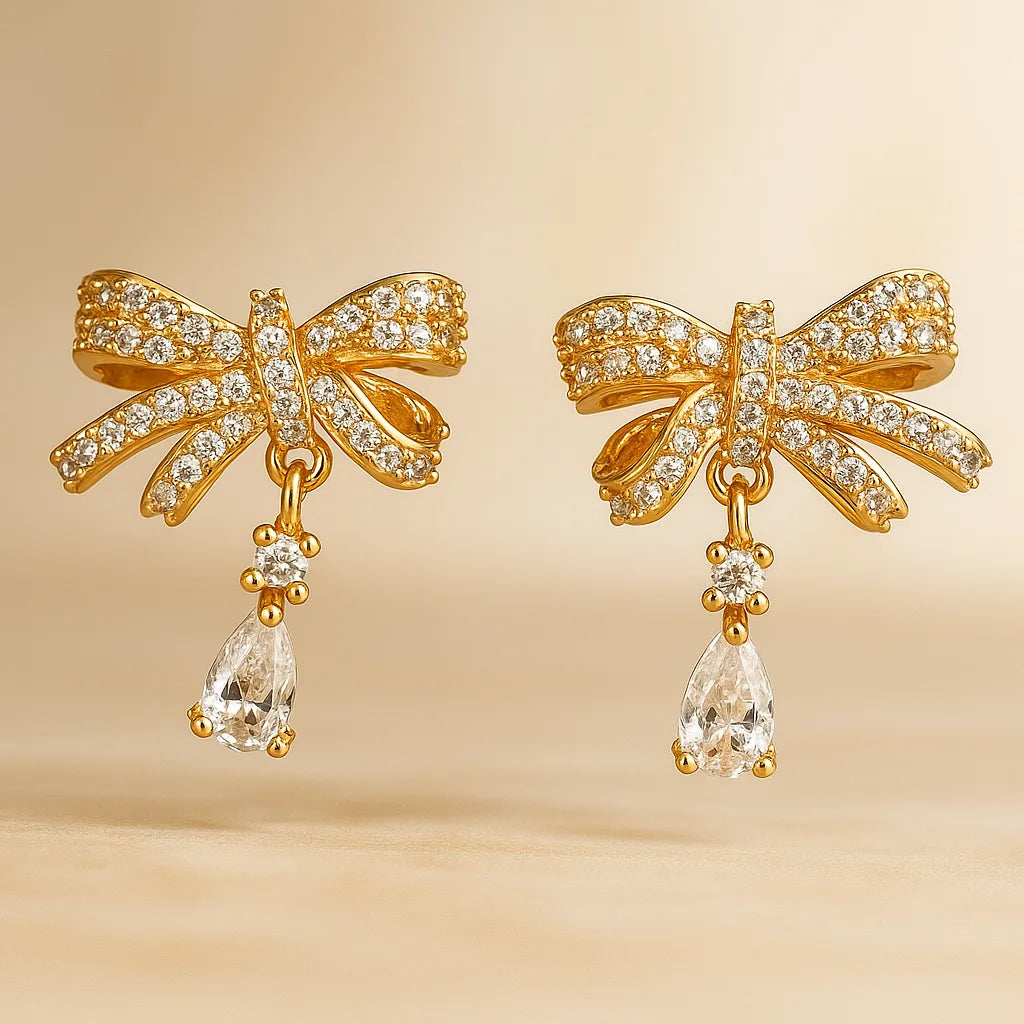 Gold-Toned Bow-Shaped Stud Earrings with Amw=erican Diamond